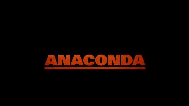 Title card for the movie 'ANACONDA' displayed in orange text on a black background.