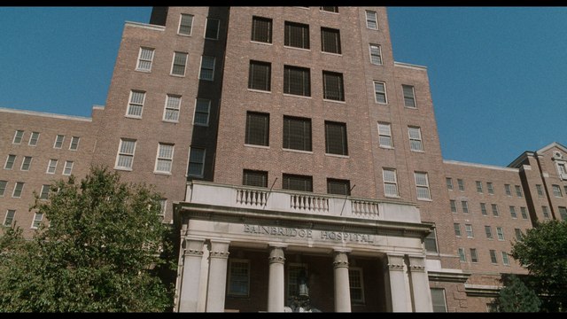 Exterior view of the Bronx Psychiatric Center building, featuring a brick facade and prominent entrance.