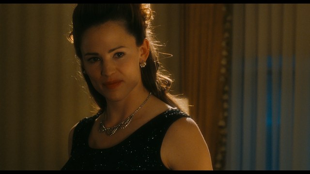 Two characters wearing red bandanas look surprised while standing in a dimly lit indoor setting.