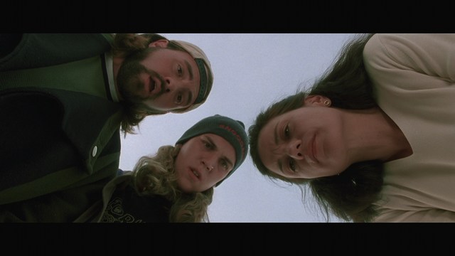 Three characters looking down in shock or concern, with a snowy background.