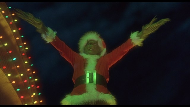 Scene from the movie featuring two characters, one with a beard and the other with long hair, both wearing red bandanas and looking surprised.