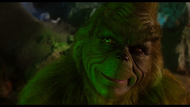 Three characters looking down with surprised expressions, framed from below.