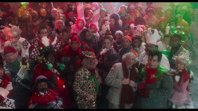A scene featuring five characters in a bar setting, with a focus on their expressions and interactions. The backdrop includes bar shelves with bottles and a bartender visible in the background.