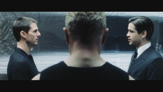 A scene from a film showing five characters in a bar setting, with a colorful background and a bartender visible in the back.