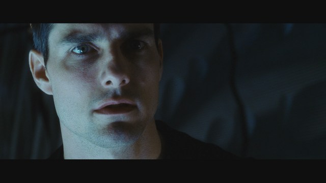 Scene from the movie featuring two characters, one with a beard and the other with long hair, both wearing red bandanas and looking surprised.