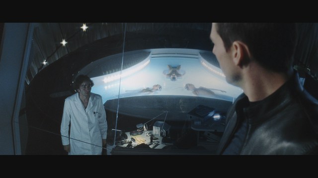 Two figures walking along a highway next to a 'Welcome to New Jersey' sign, with greenery in the background.
