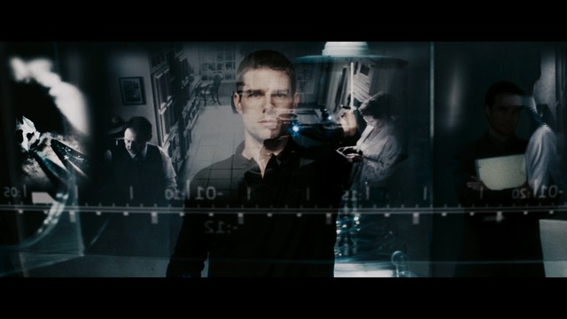 Statue of a smiling figure resembling Jesus, giving a thumbs up gesture, set against a colorful backdrop with signs related to Catholicism.