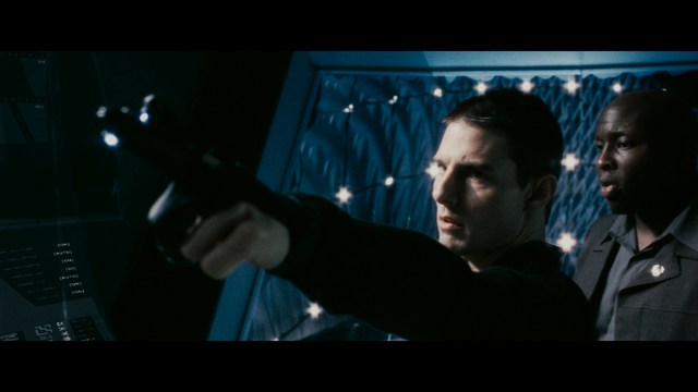 A close-up of a person's hand holding a crumpled newspaper with the headline "Mooby's: Creating an Empire Out of Simplicity" and a graphical chart showcasing growth, titled "It was a very Good YEAR."