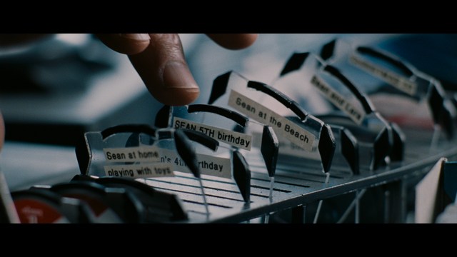 Three characters looking down with surprised expressions, framed from below.