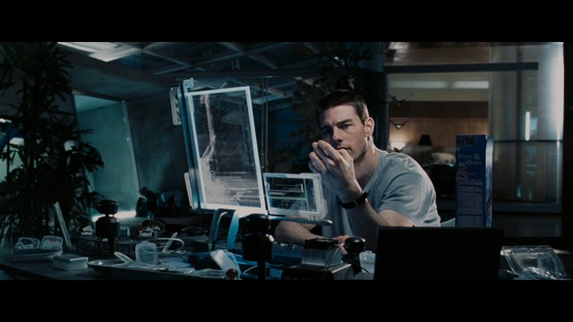 A scene featuring a man with short hair and a beard, wearing a brown jacket and purple shirt, standing outside a restaurant with bright yellow walls and a cartoon cow logo.