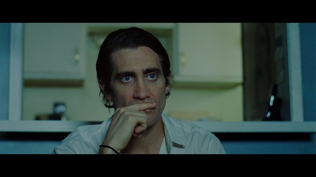 A group of characters in futuristic gear, looking tense and alert, possibly in a sci-fi setting.