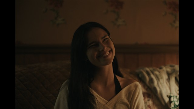 Two characters wearing red bandanas look surprised while standing in a dimly lit indoor setting.