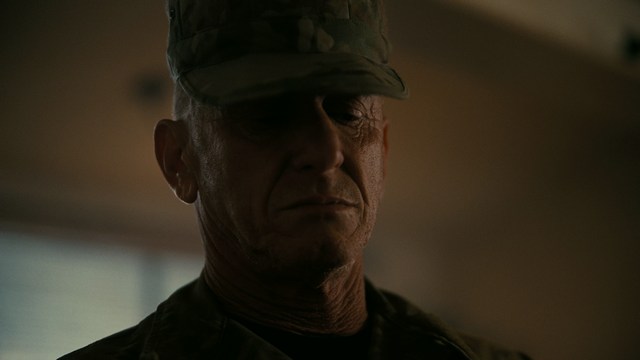 Three characters looking down with surprised expressions, framed from below.