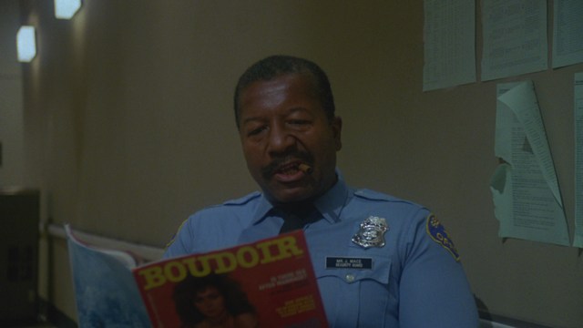 Two figures walking along a highway next to a 'Welcome to New Jersey' sign, with greenery in the background.