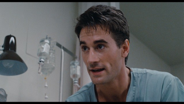 A close-up of a person's hand holding a crumpled newspaper with the headline "Mooby's: Creating an Empire Out of Simplicity" and a graphical chart showcasing growth, titled "It was a very Good YEAR."