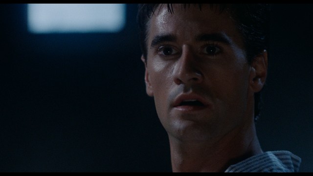 Three characters looking down with surprised expressions, framed from below.