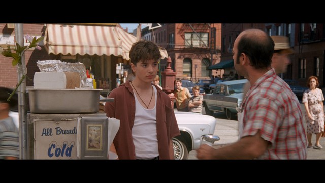 Three characters looking down with surprised expressions, framed from below.