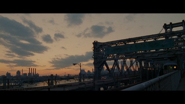 Close-up of a man with a concerned expression, wearing a suit, with a blurred background suggesting an indoor setting.