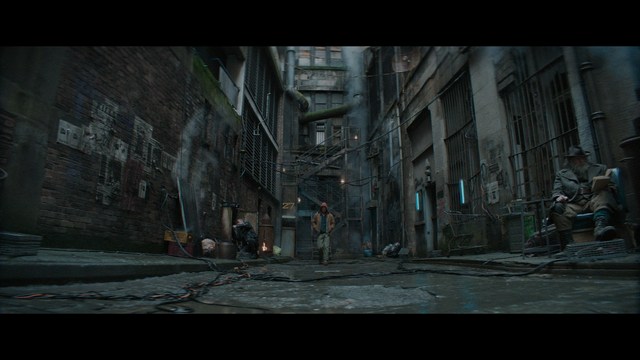 A group of people standing in a church, with a focus on a woman in a striped blazer looking up, while others are holding books or looking ahead.