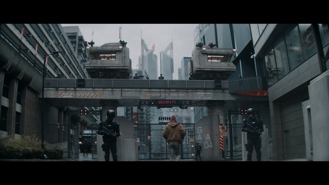 Four anthropomorphic turtles in ninja attire stand in a dimly lit room, while a humanoid character with fur sits nearby.