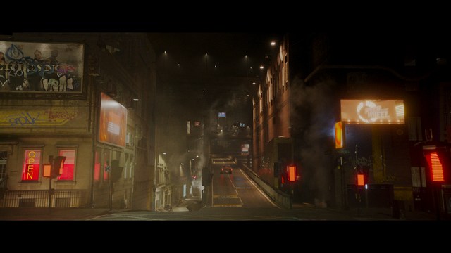 A scene from the film showing two male characters, one in a futuristic helmet and uniform, smiling while the other appears tense, conveying a sense of intrigue.