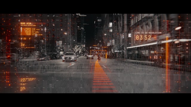 Two characters sitting at a table, one holding a small statue, with a surprised expression. The background features vibrant colors and patterns.