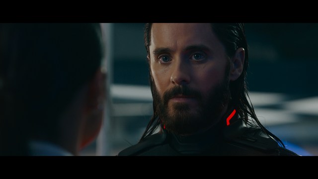 A group of characters in futuristic gear, looking tense and alert, possibly in a sci-fi setting.