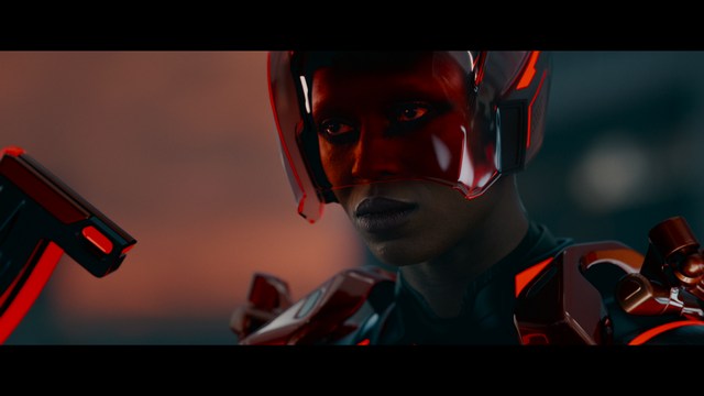 A scene from the film showing two male characters, one in a futuristic helmet and uniform, smiling while the other appears tense, conveying a sense of intrigue.