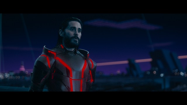 Close-up of a man with a concerned expression, wearing a suit, with a blurred background suggesting an indoor setting.