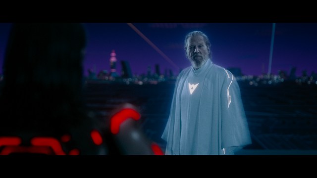 Scene featuring a character in a glowing white robe with long hair, standing in a futuristic environment at night with a city skyline in the background.