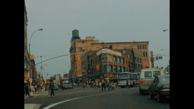 Three young individuals sitting together, two holding hockey sticks, with a casual and intense expression in a domestic setting.